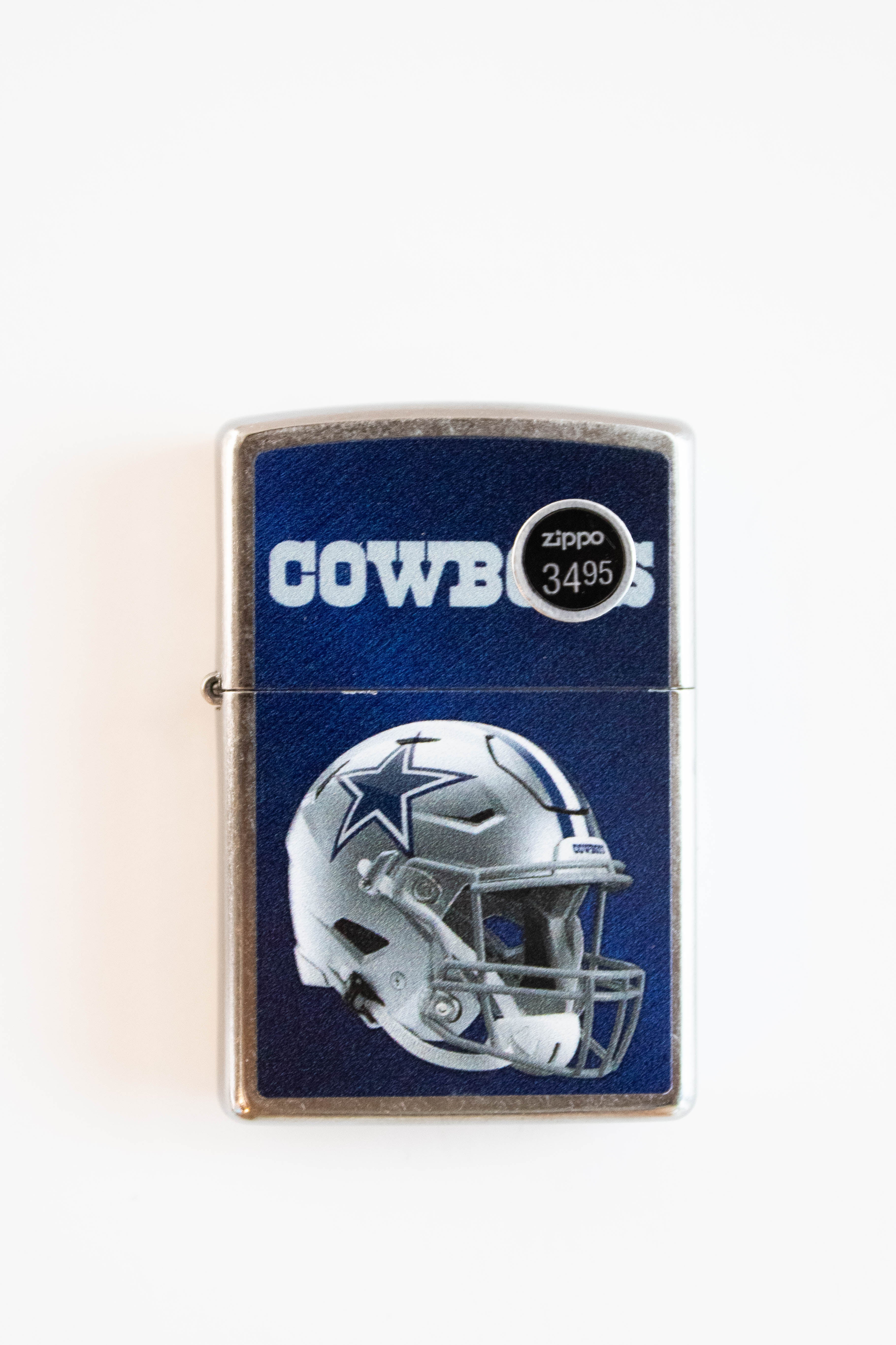 Zippo lighter featuring Dallas Cowboys street style design