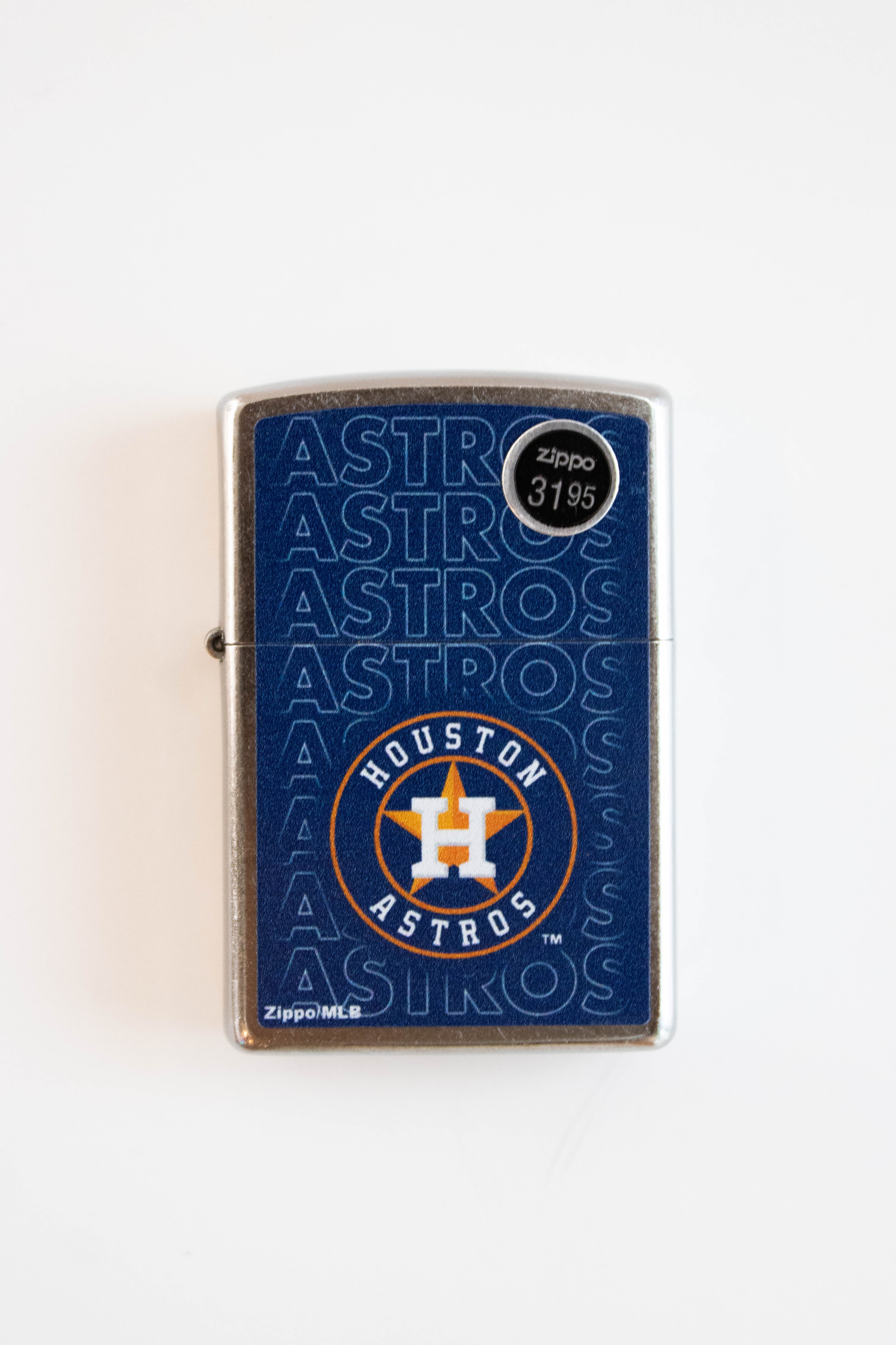 Zippo lighter featuring Houston Astros baseball team logo