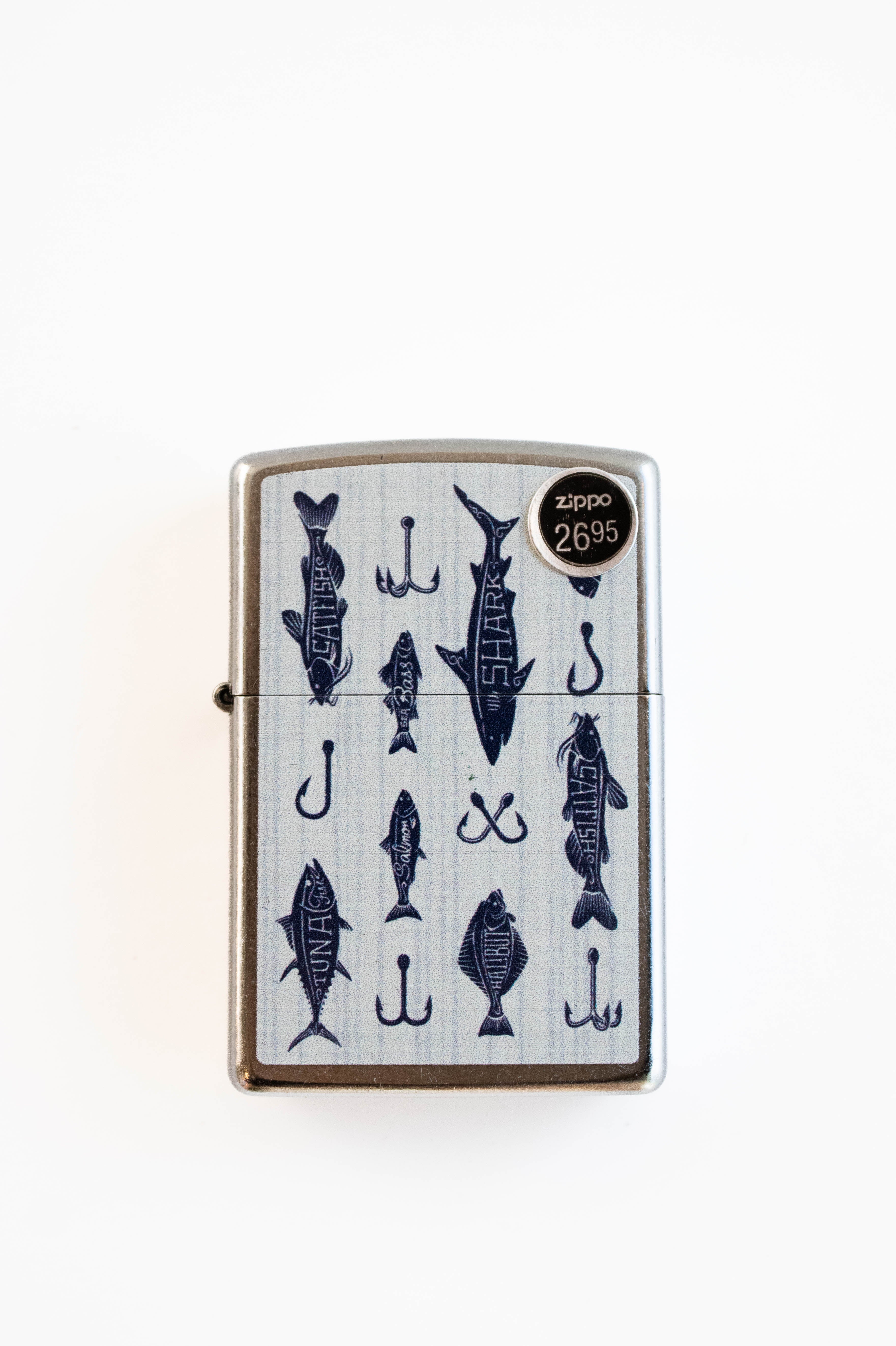Zippo lighter featuring off the hook fishing themed artwork