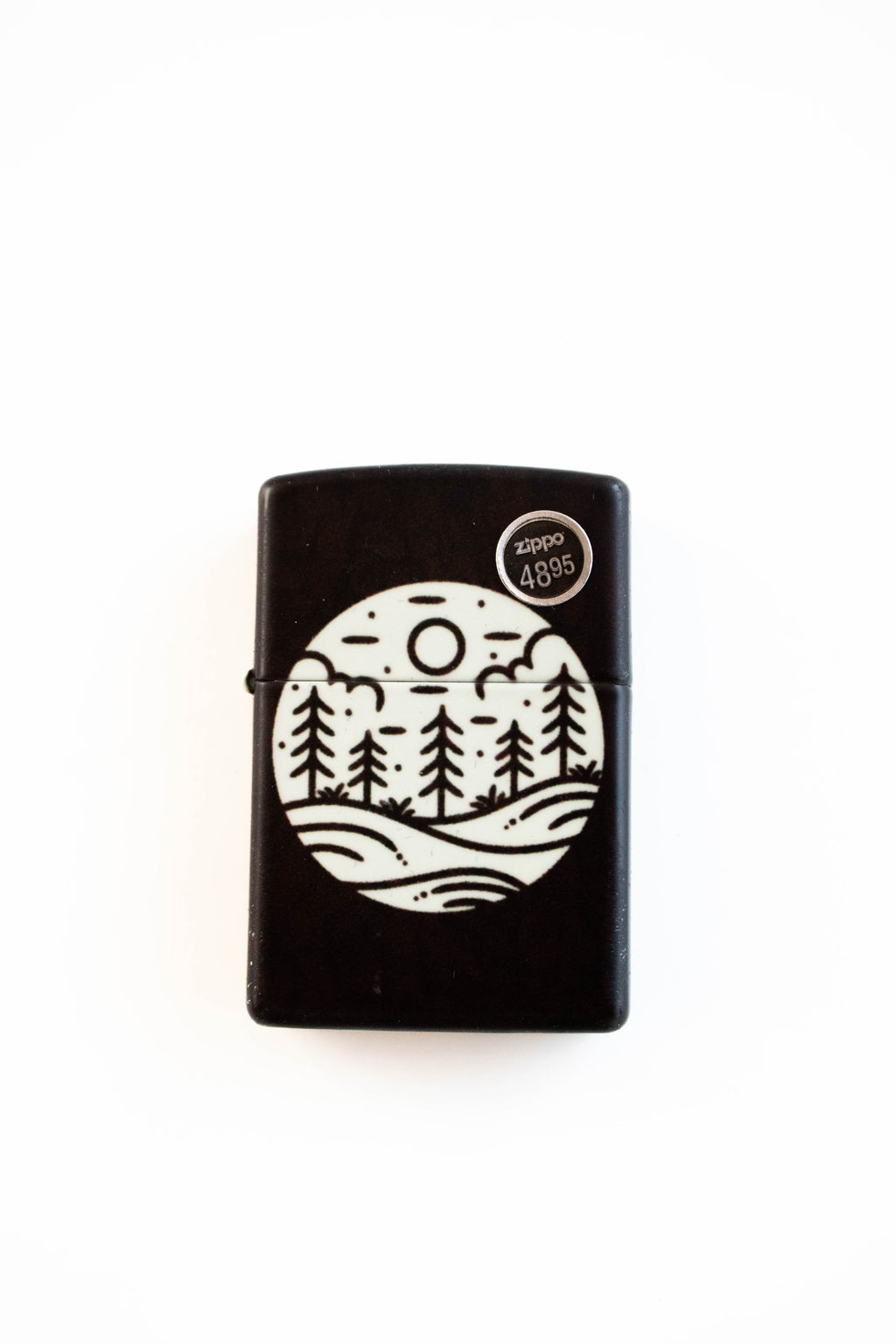 Zippo lighter featuring moonlit field glow in the dark artwork