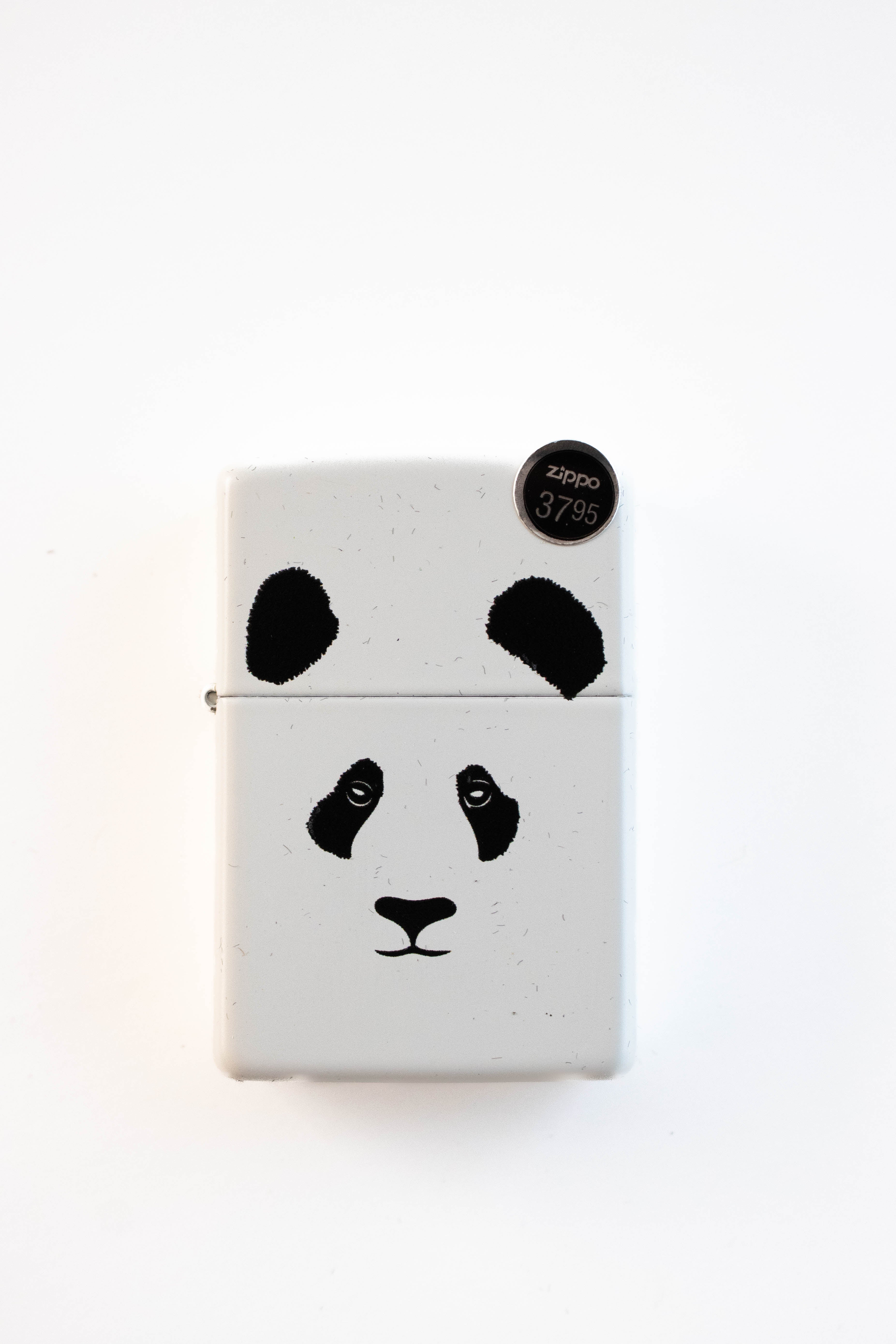 Zippo lighter featuring panda bear illustration