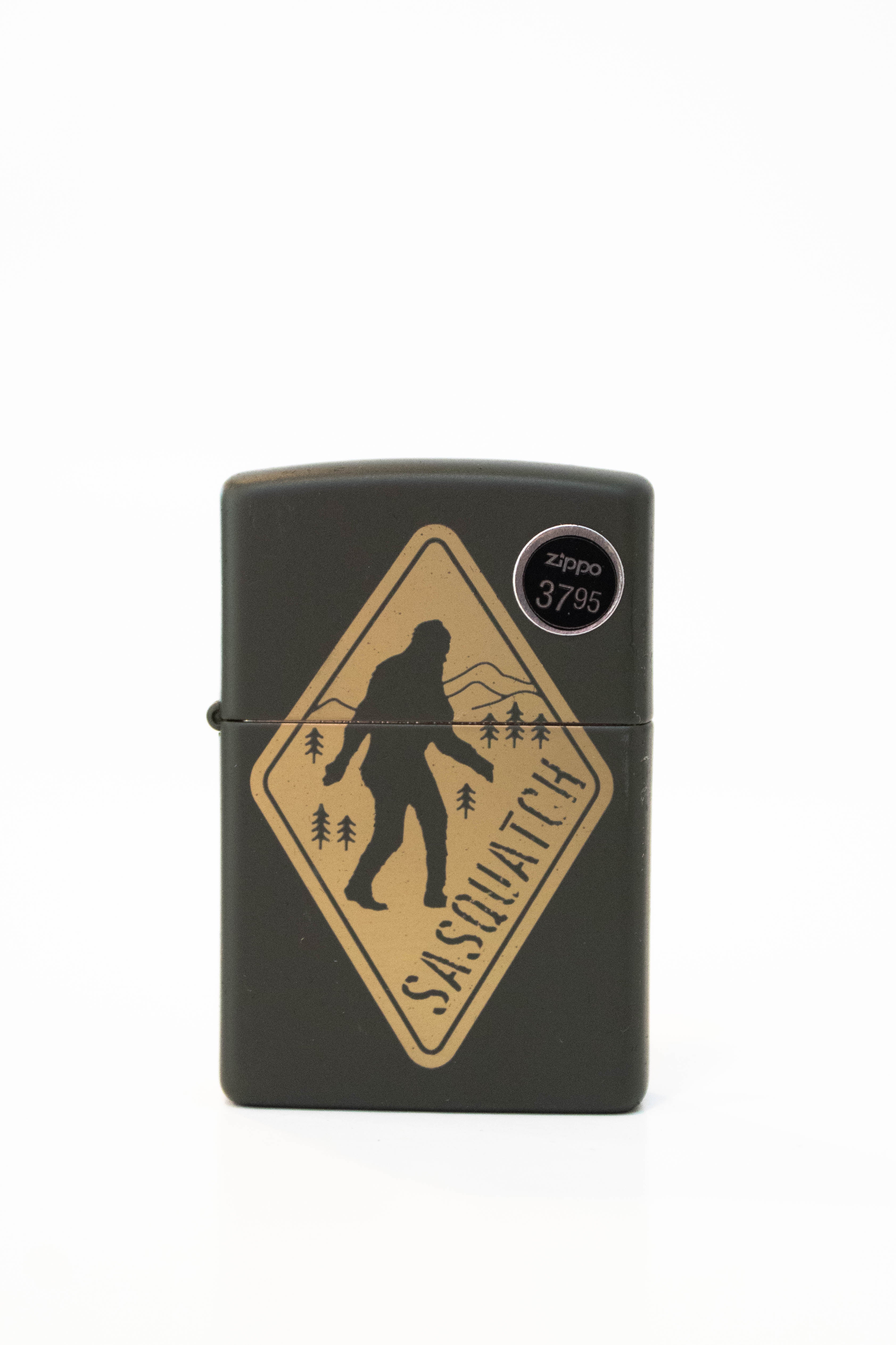 Zippo lighter with engraved Sasquatch warning sign design