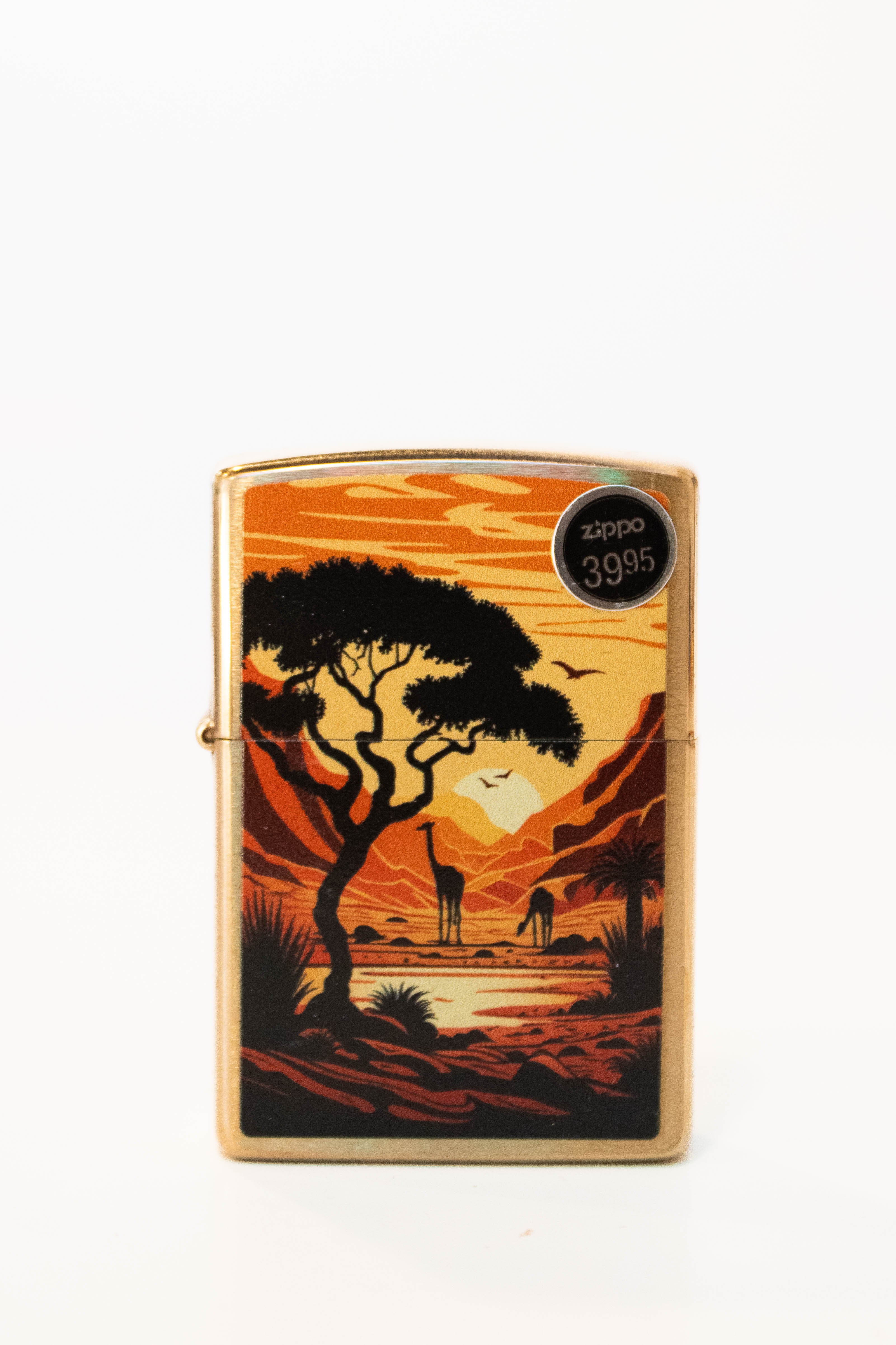 Zippo lighter featuring giraffes in the wild artwork on brushed brass