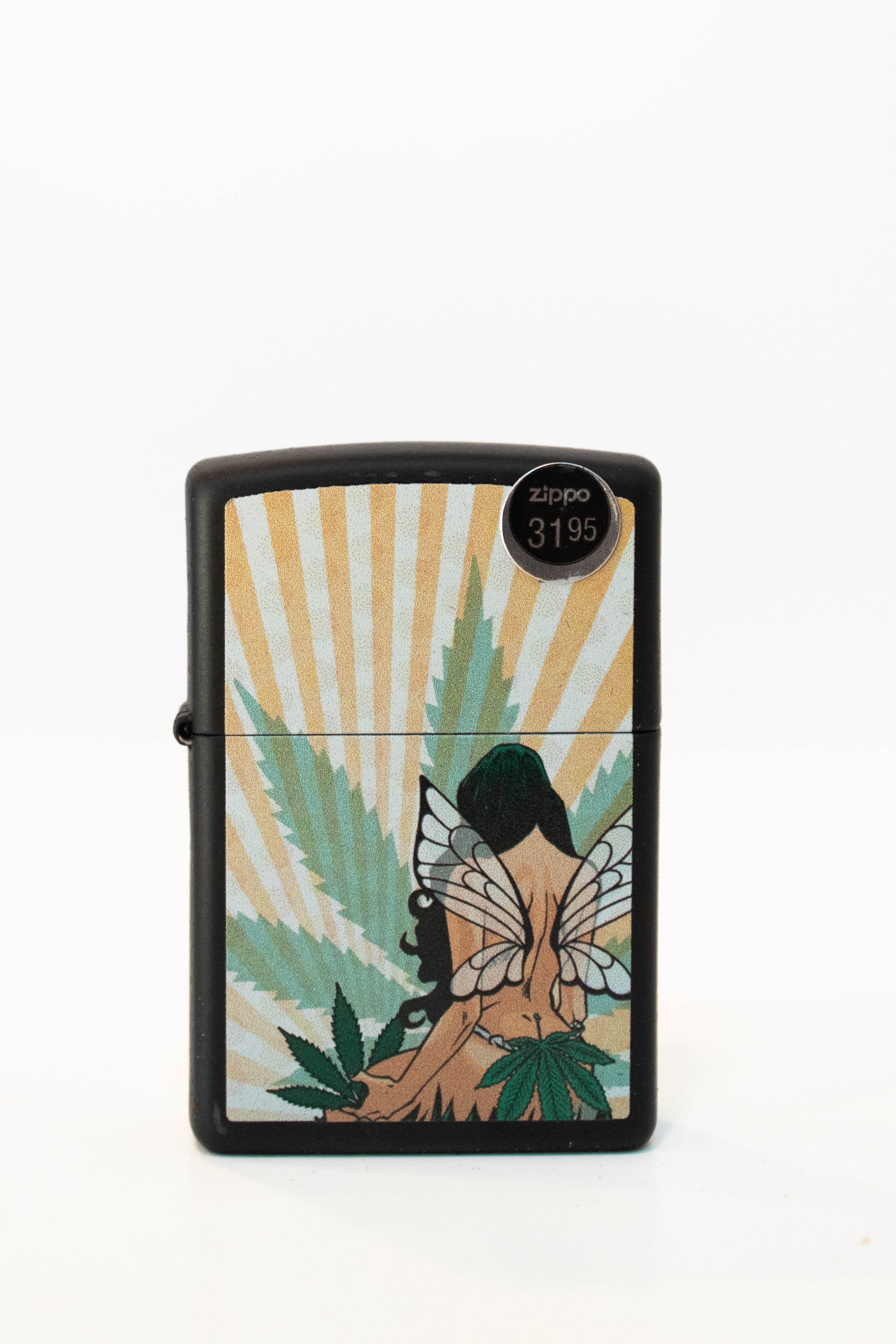 Zippo lighter featuring fairy artwork with cannabis leaf