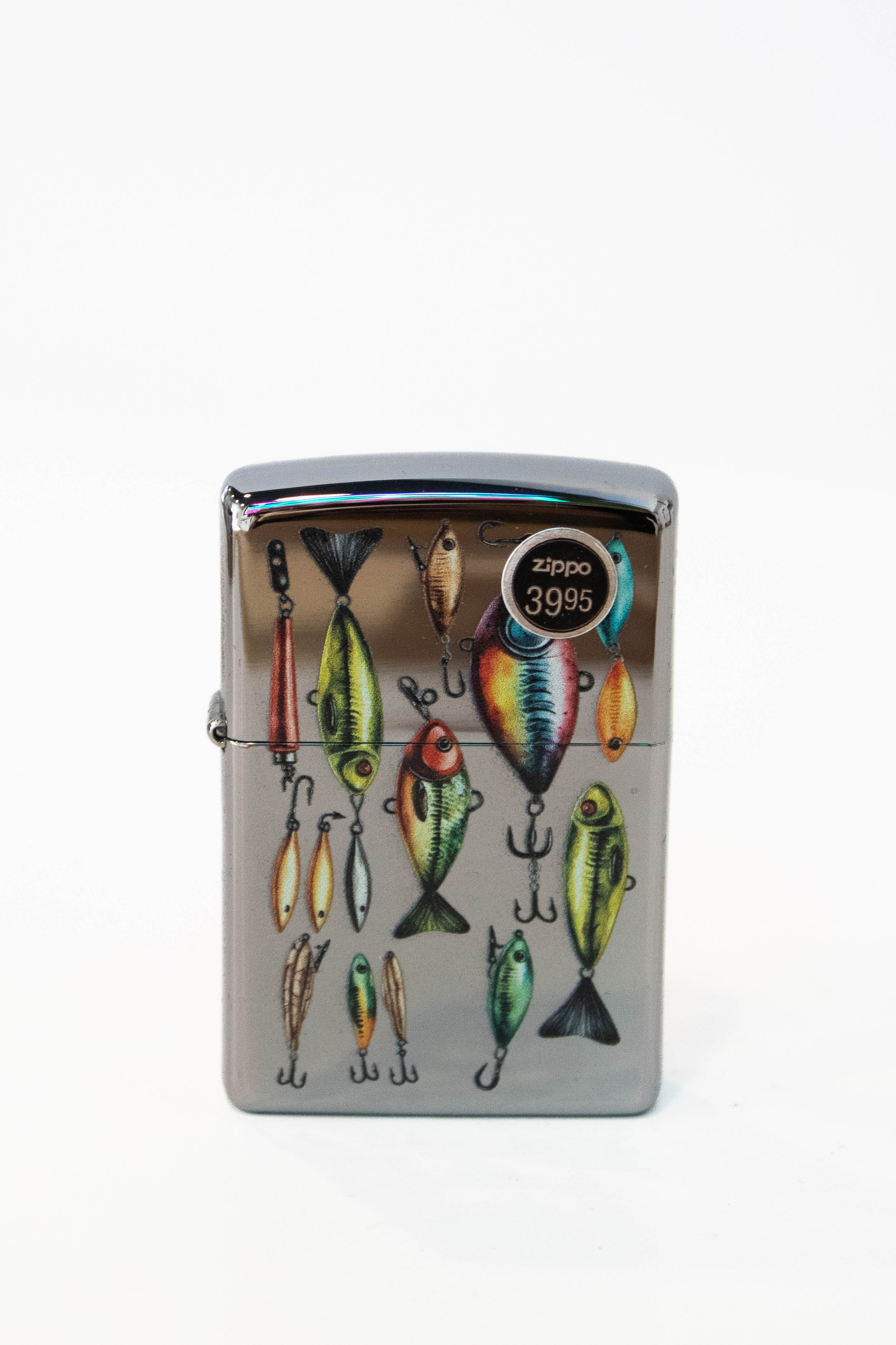 Zippo lighter featuring fishing lures artwork on high polish chrome