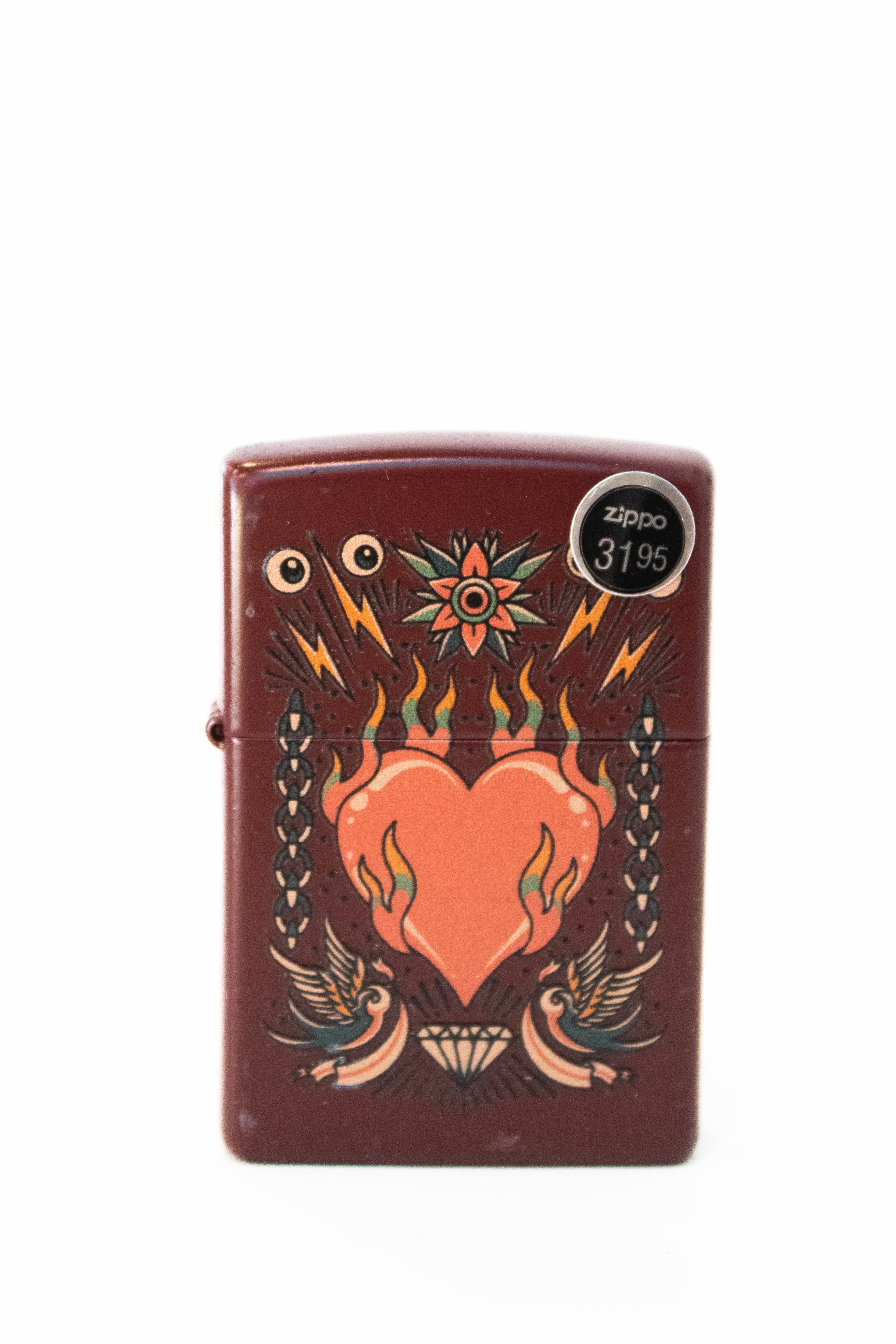 Zippo lighter with tattoo style heart design in merlot color