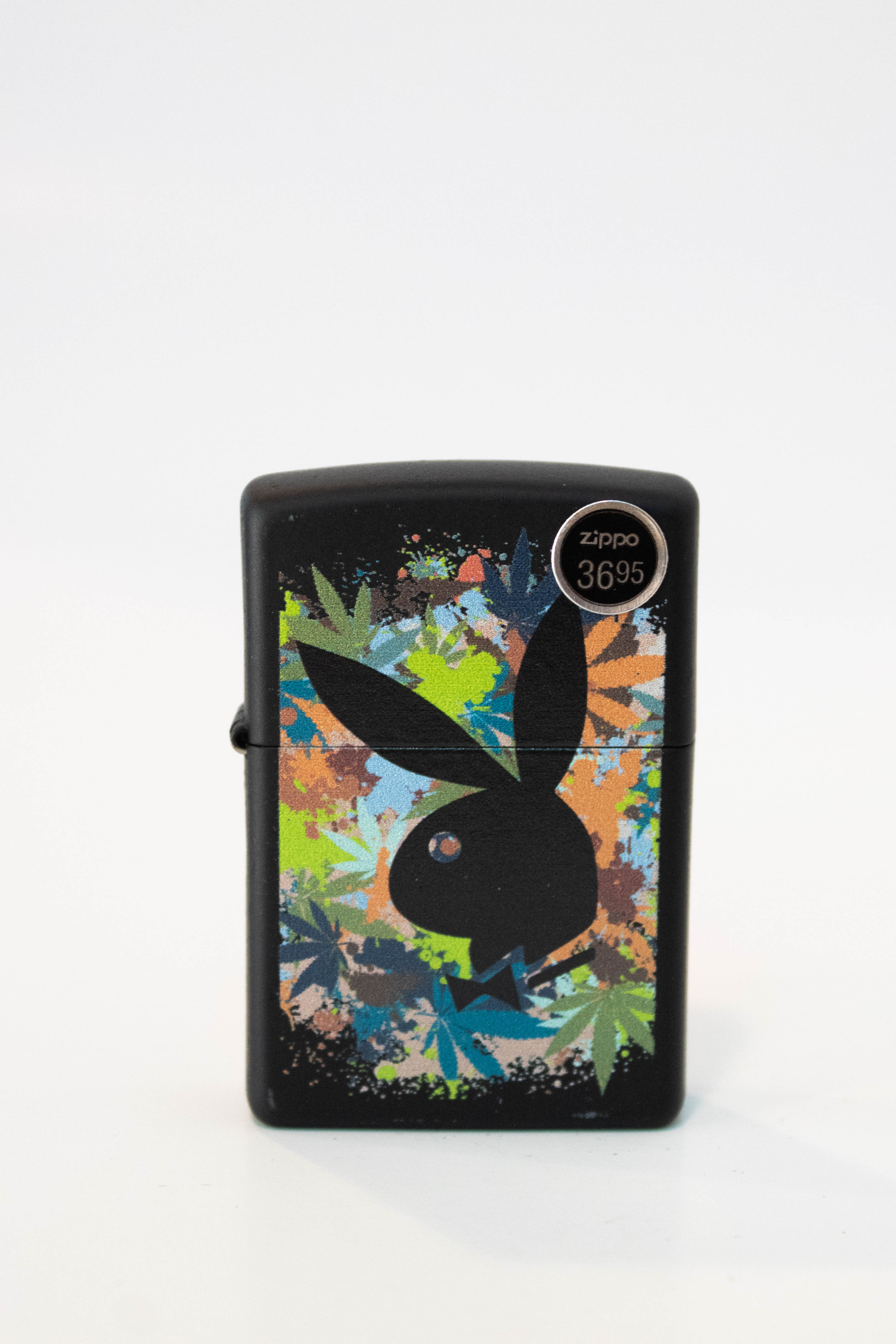 Zippo lighter featuring Playboy Bunny with cannabis leaf artwork