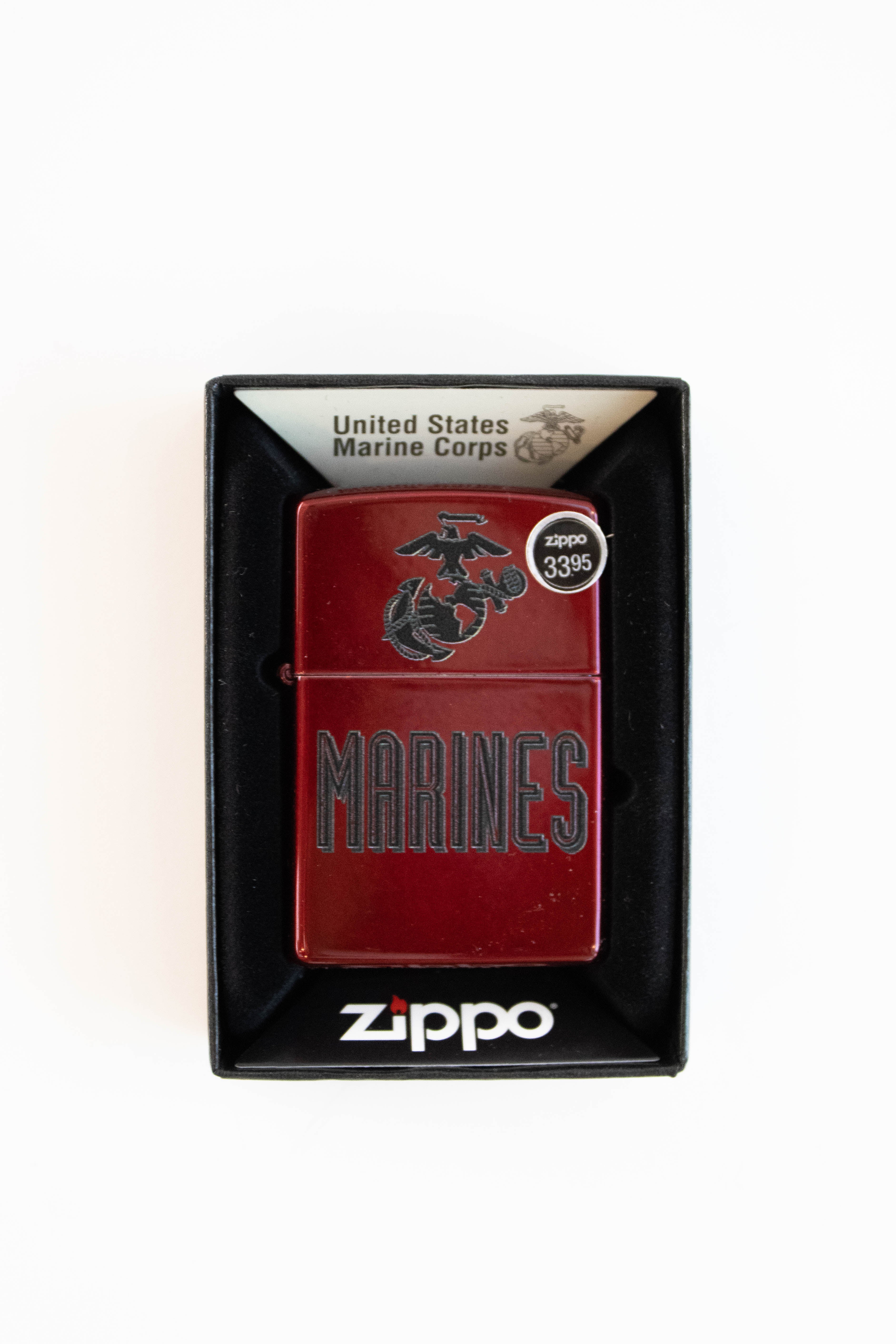 Zippo lighter with US Marine Corps crest in candy apple red finish