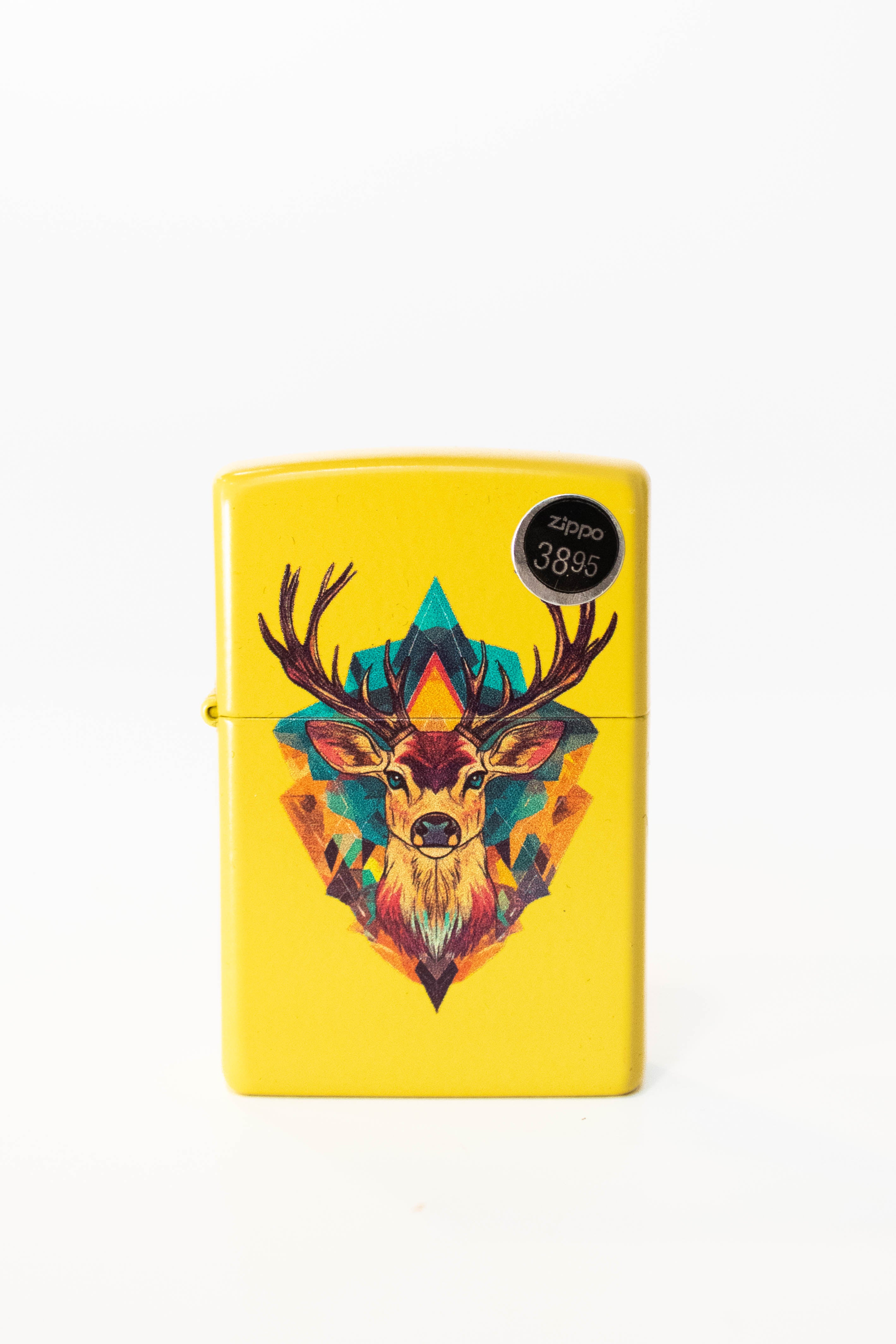 Zippo lighter featuring deer illustration on sunflower yellow finish